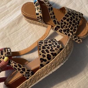 Size 8 Cheetah print Platform sandals.
